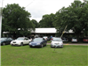 Cars parked in lot for large picnic shelter