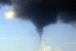 Image of a funnel dropping from a cloud