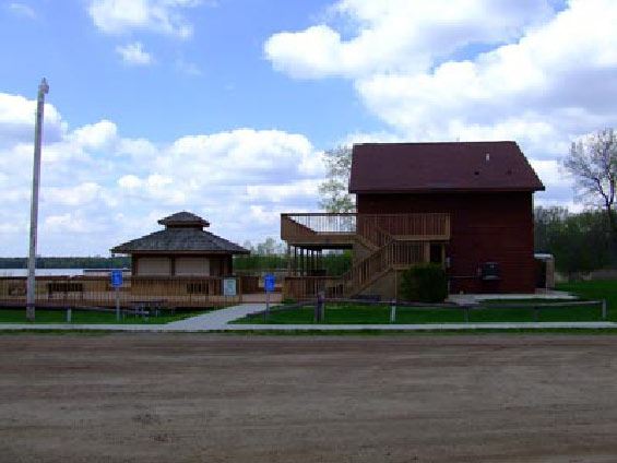 Image of two story building with parking lot
